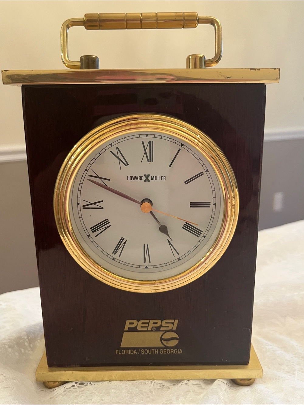Howard Miller Pepsi Brass Accent Table Clock in Gold and Dark Wood